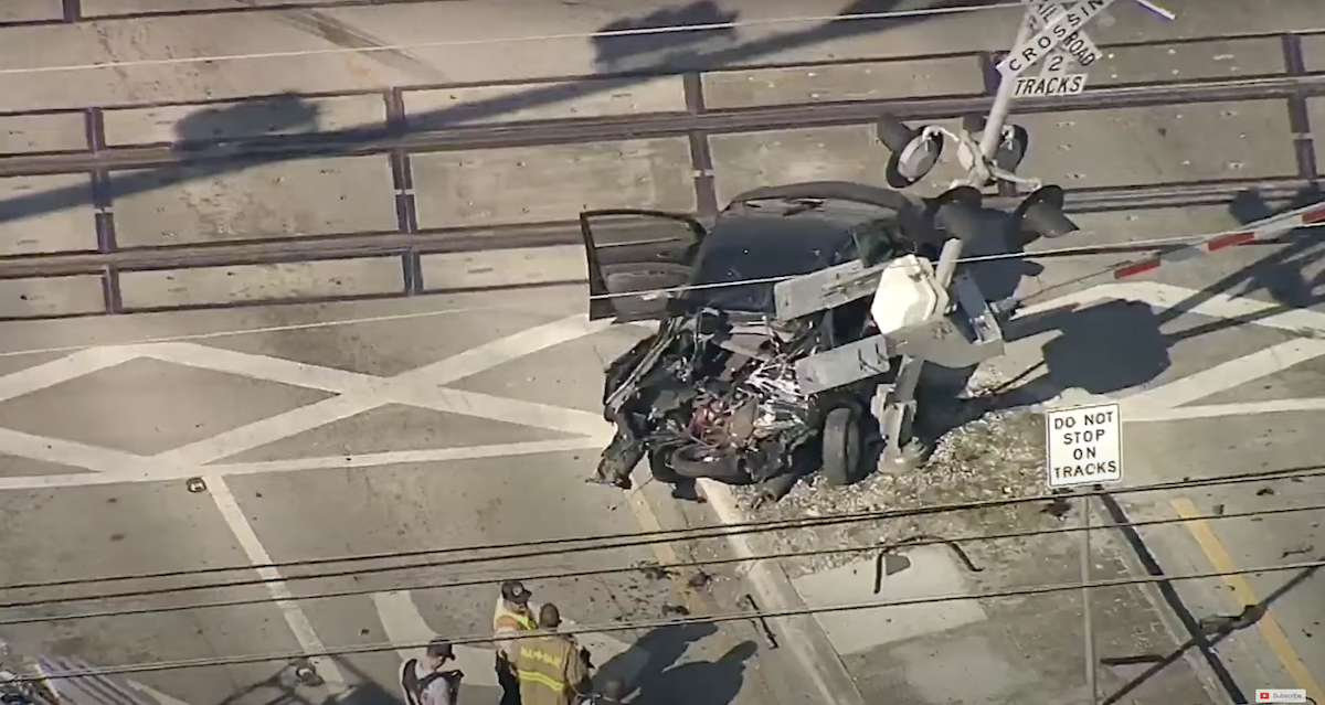 A wrecked car that was just hit by a Brightline train.