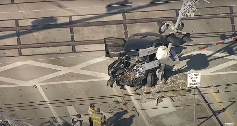 A wrecked car that was just hit by a Brightline train.