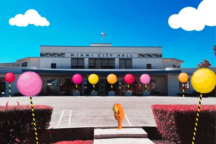 A photo illustration of the Lorax, a character representing the voice of nature in a Dr. Seuss book, in front of Miami City Hall.