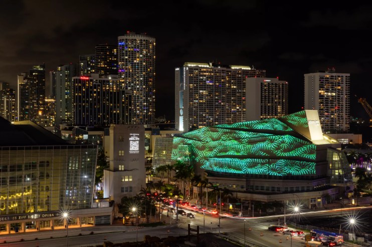 colorful art projection is projected onto a building in downtown Miami