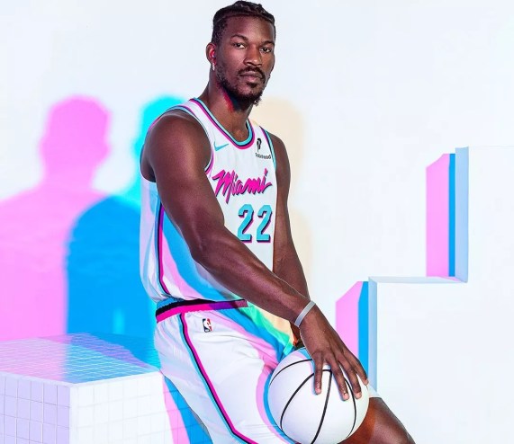 Jimmy Butler models the Miami Heat's rebooted white Miami Vice-inspired uniforms.