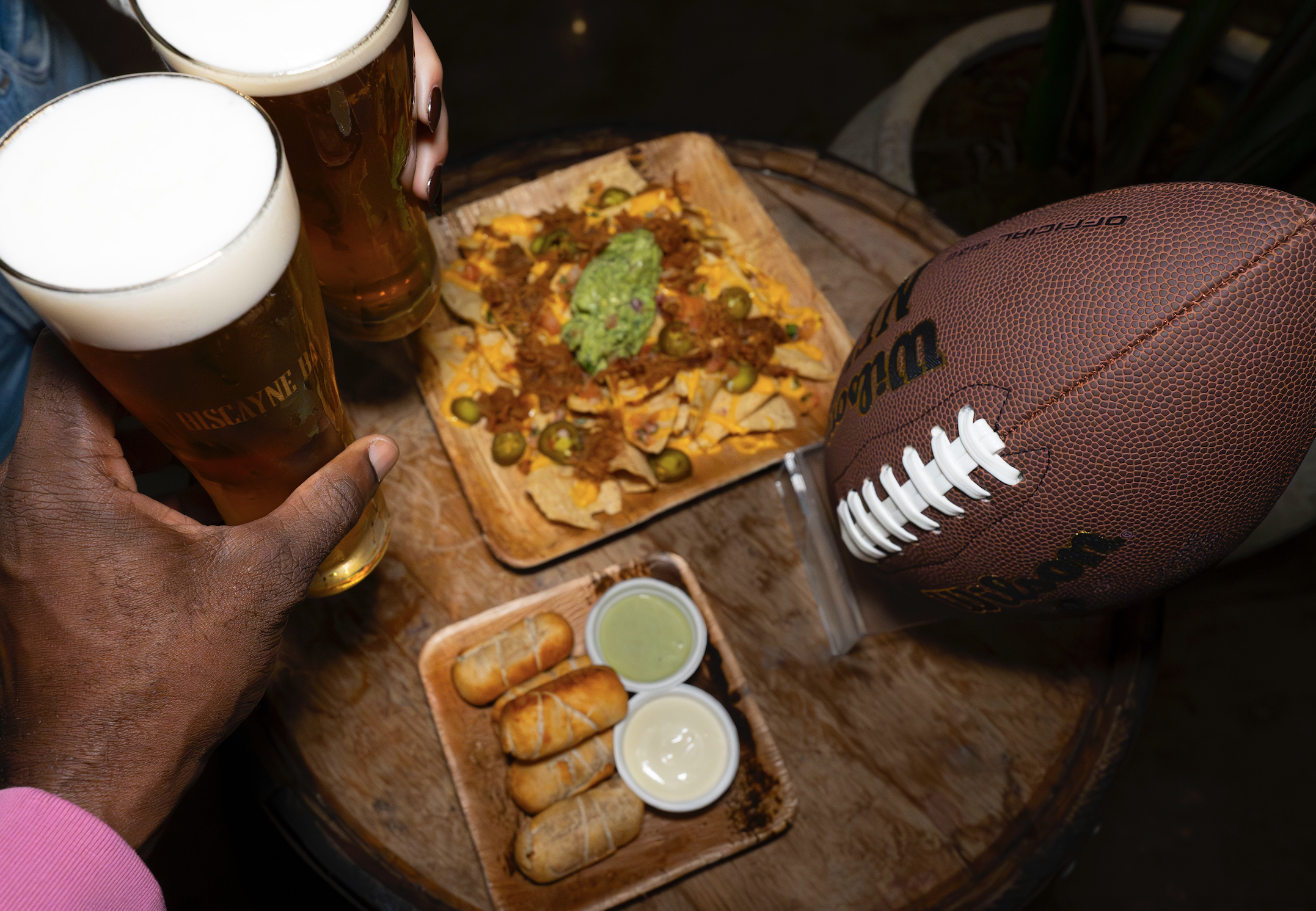 hands and beer and football