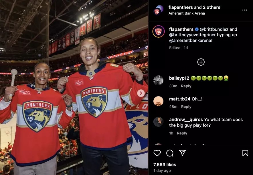Brittney Sykes (left) and Brittney Griner smiling wearing red Florida Panthers jerseys.