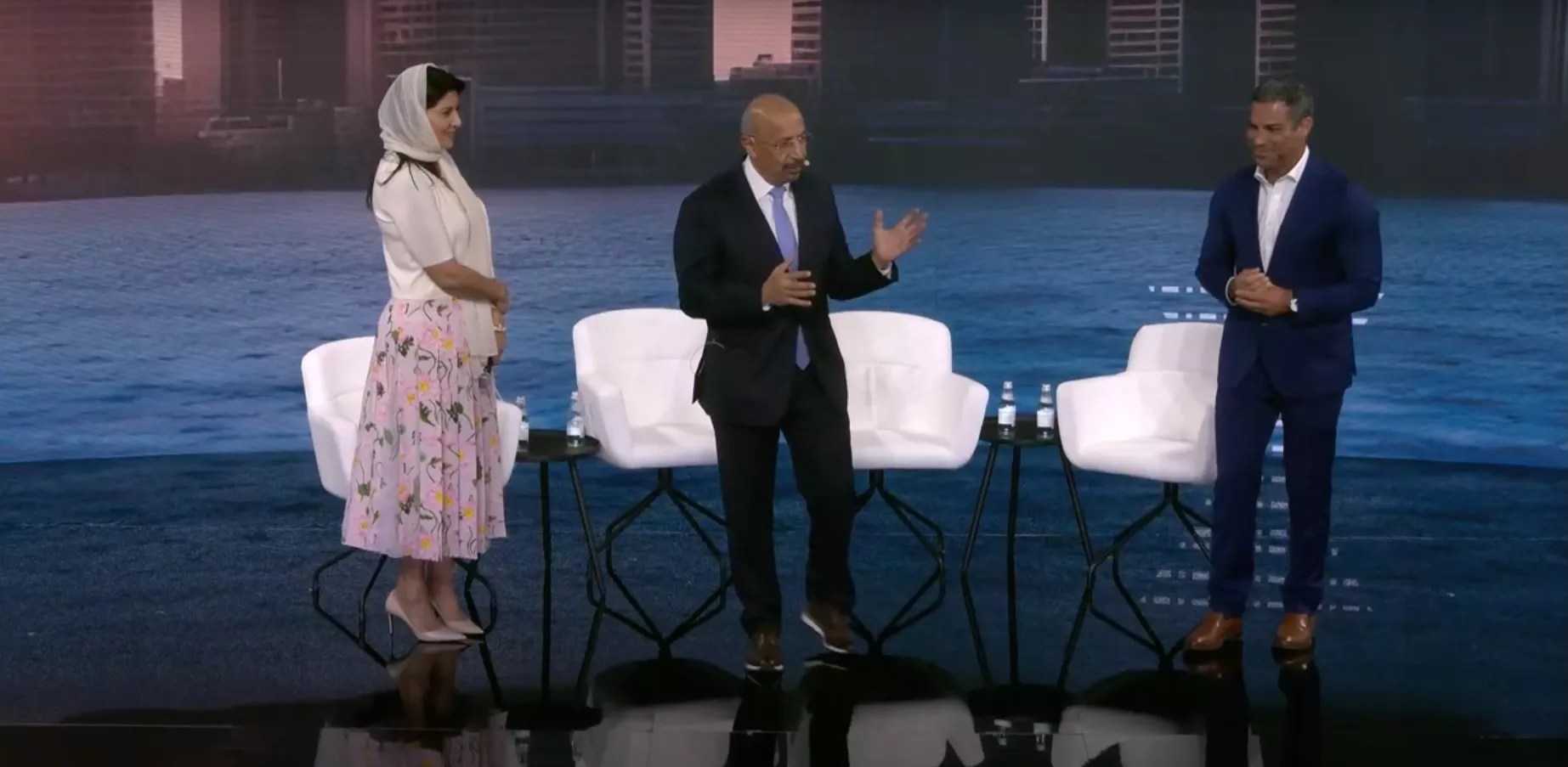 The Saudi Arabian ambassador to the U.S. (far left), Saudi Arabia minister of investment (middle), and Miami Mayor Francis Suarez (right) stand on stage at the FII Priority Summit in Miami Beach.