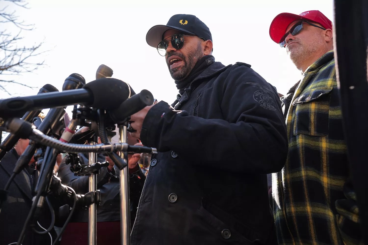 Enrique Tarrio, former leader of the far-right group the Proud Boys, speaks to journalists on the east side of the U.S. Capitol on February 21, 2025, in Washington, DC. The news conference was held in the same area where thousands of supporters of President Donald Trump stormed the U.S. Capitol on January 6, 2021, in an attempt to halt the certification of former President Joe Biden's election victory. In one of the first acts of his second term, Trump pardoned nearly 1,600 people charged and convicted of crimes related to the attack.