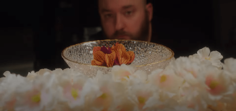 Jacob Bickelhaupt looking at a dish at his restaurant, Konro.