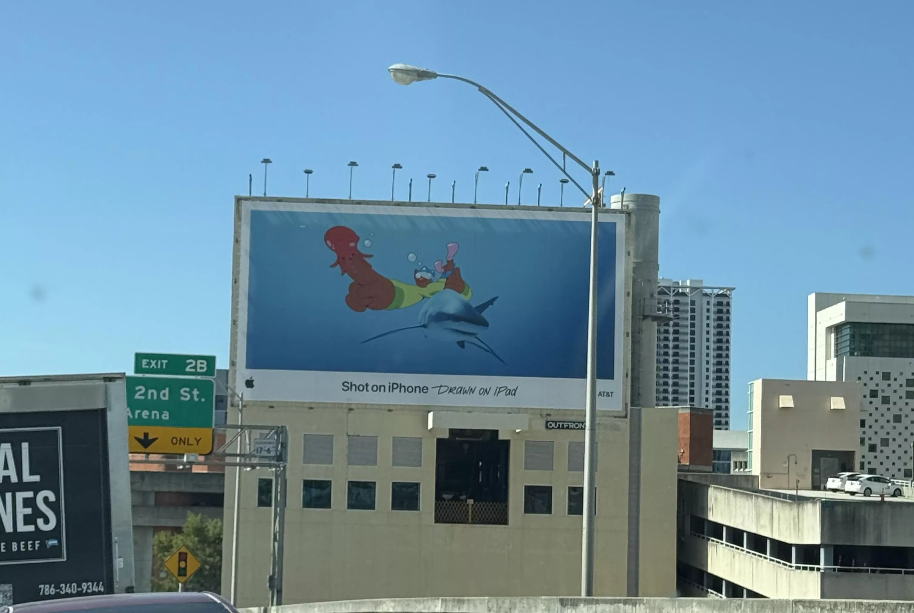 An Apple ad features a phallic-shaped image on I-95 in Miami.