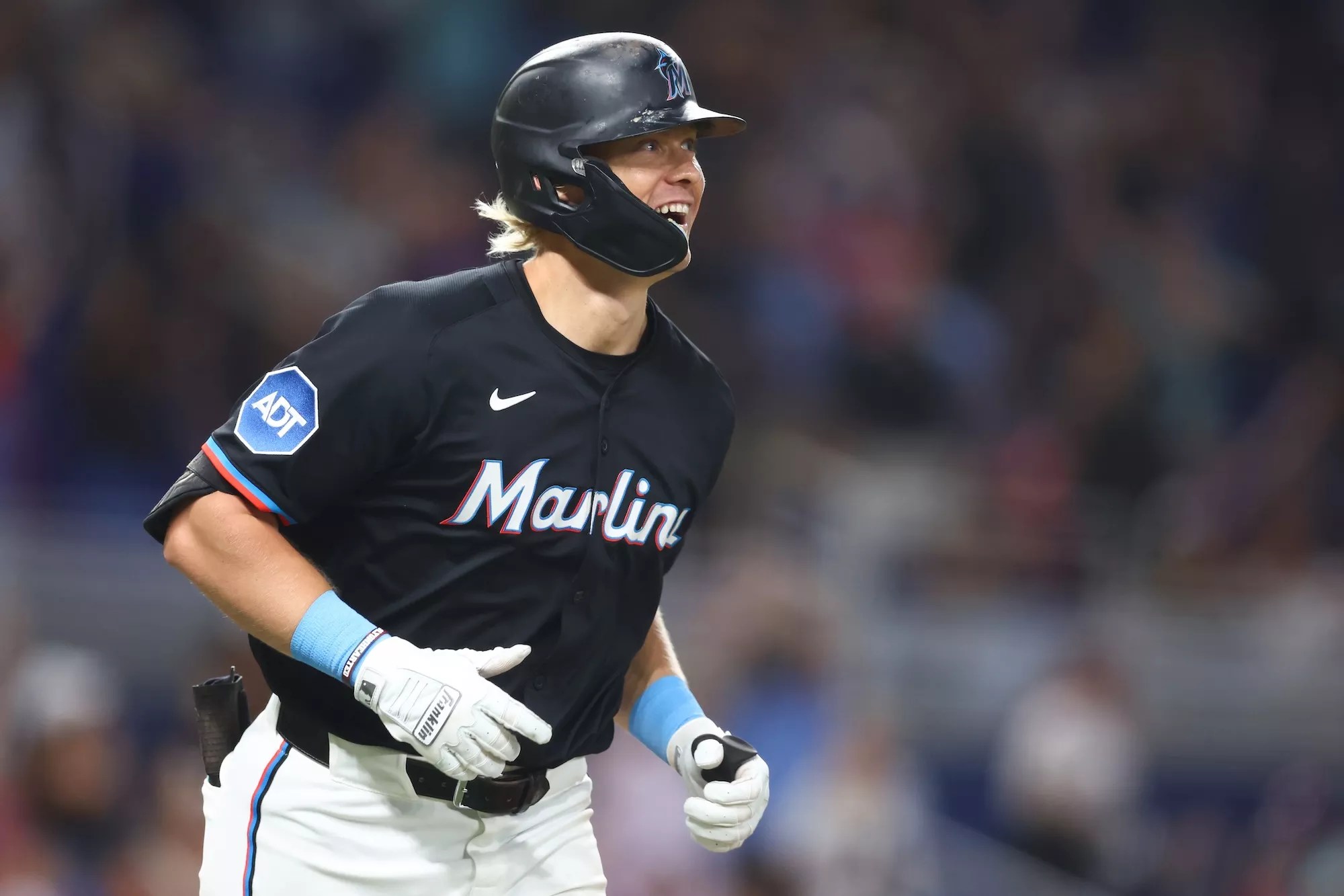 Miami Marlins left fielder Kyle Stowers #28 smiles as he rounds the bases after hitting a walk-off home run at LoanDepot Park in Miami, Florida