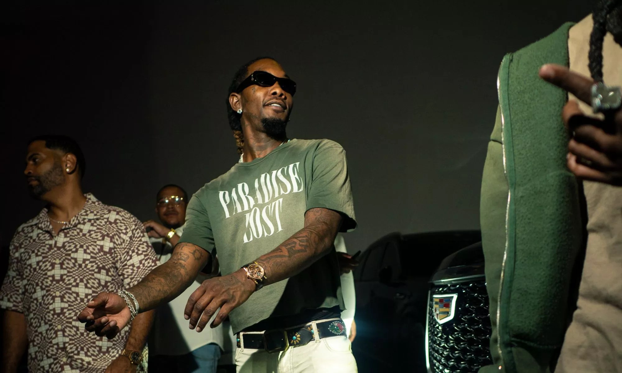 Picture of rapper Offset getting out of a car.