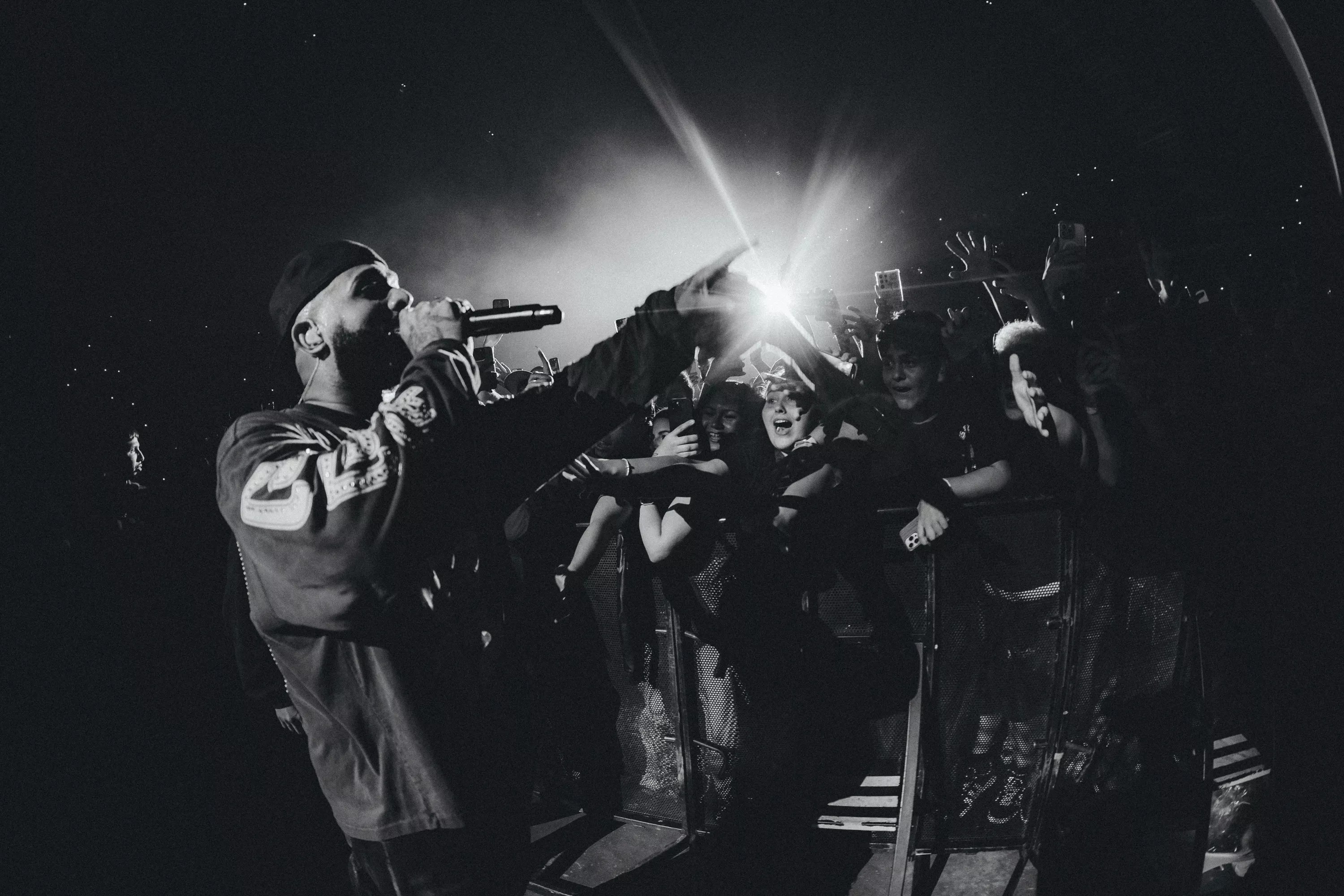 Picture of Eladio Carrion performing in front of fans.